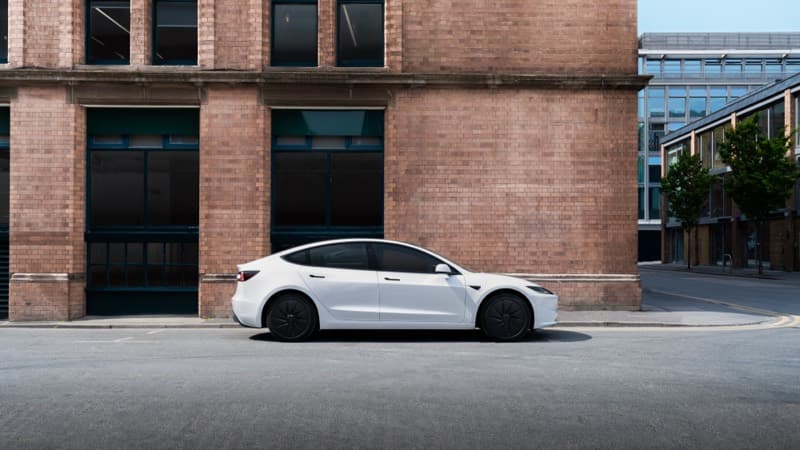 White Tesla Model 3 parked on a city street