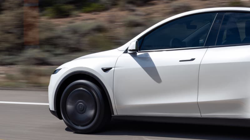 White Tesla Model Y on the road